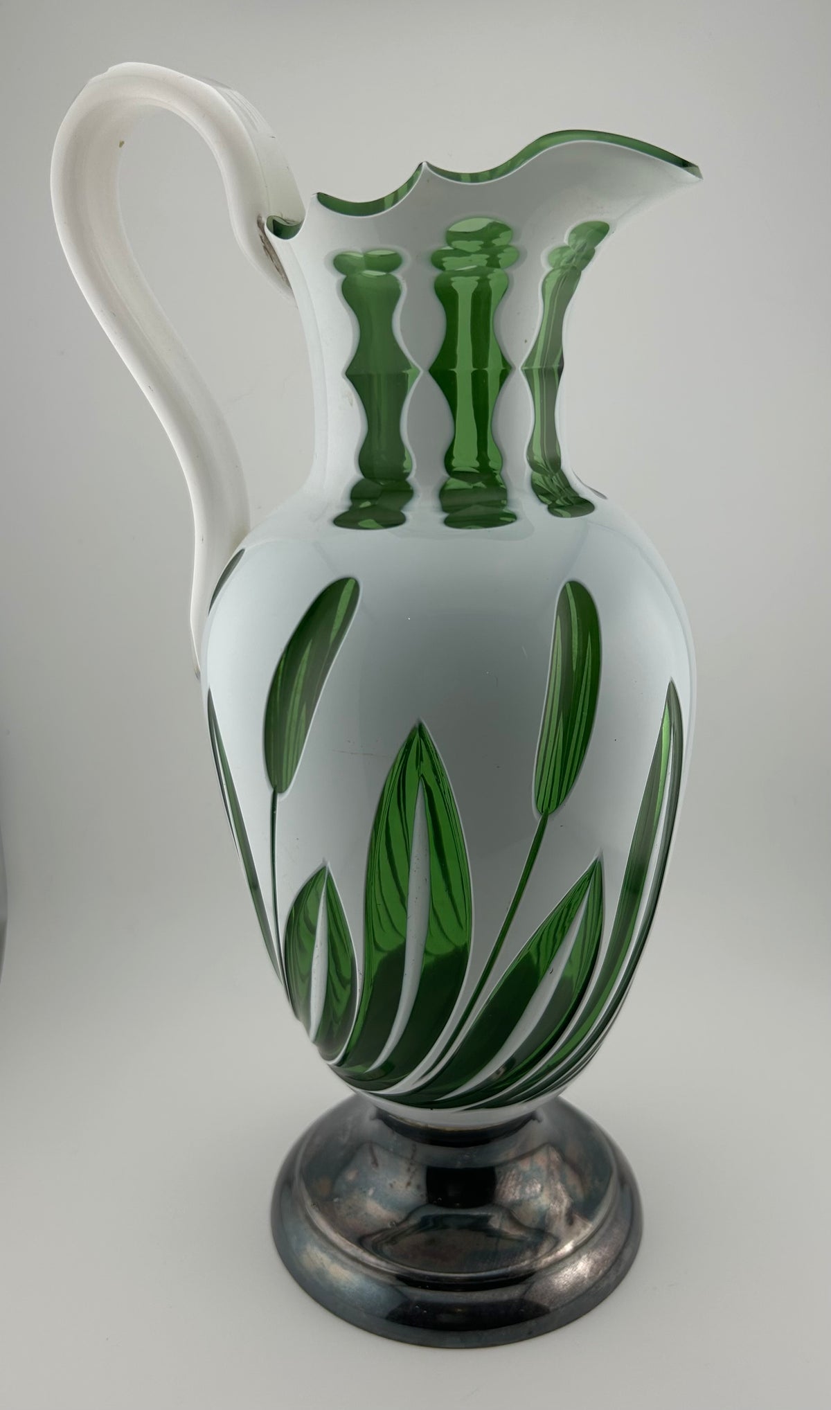 White Over Green Glass Pitcher with Cat Tail Motif and Silver Plate Base